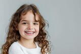 cheerful little girl with braces adorable smile dental health happiness studio portrait photo