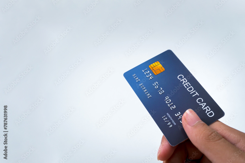 Credit card, in user's hand, focus on card, background. Isolate, banner, advertising space, copy space. Credit card, in user's hand, focus on card, background. Isolate, banner, advertising space, copy space.