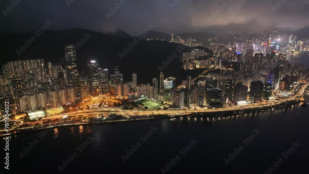 Aerial drone dusk nightfall skyview of Hong Kong Kowloon Victoria Harbour Tsim Sha Tsui Hung Hom Central Admiralty Wan Chai Causeway Bay CBD financial business Aerial drone dusk nightfall skyview of Hong Kong Kowloon Victoria Harbour Tsim Sha Tsui Hung Hom Central Admiralty Wan Chai Causeway Bay CBD financial business