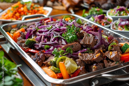 Buffet with meat and colorful vegetables on table