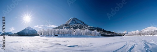Sun shining over a serene snowy landscape with tall pine trees and majestic mountains.