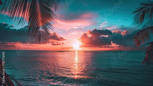 Tropical sunset view through palm leaves