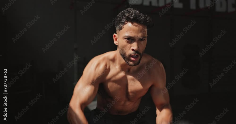 Man, battle rope and exercise athlete for gym performance or muscle building with arm workout, fitness or training. Male person, equipment and fast speed with cardio wellness, sports or bodybuilder Man, battle rope and exercise athlete for gym performance or muscle building with arm workout, fitness or training. Male person, equipment and fast speed with cardio wellness, sports or bodybuilder