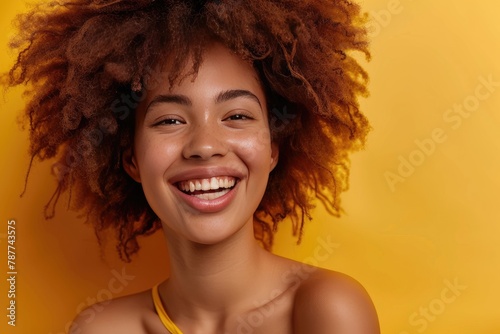 Happy young woman with afro hairstyle against colored background - generative ai © Nia™