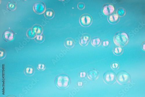 Abstract Beautiful Transparent Blue Soap Bubbles Background. Floating Bubbles Colorful. Soap Sud Bubbles Water.