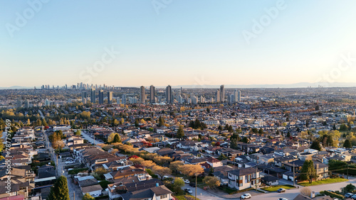 Beautiful sunset over the skyline of Burnaby in the Lower Mainland during a spring season in British Columbia, Canada photo