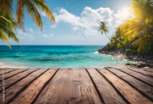Wooden deck overlooking a tropical beach with clear blue water  palm trees  and sunny sky.