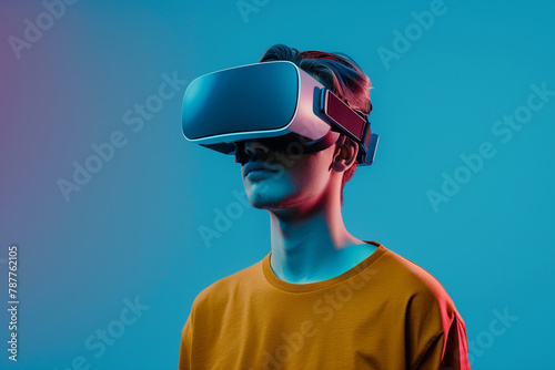 Young Man's Face Lit Up by VR Headset on Blue Background, Generative ai © Ashpezso