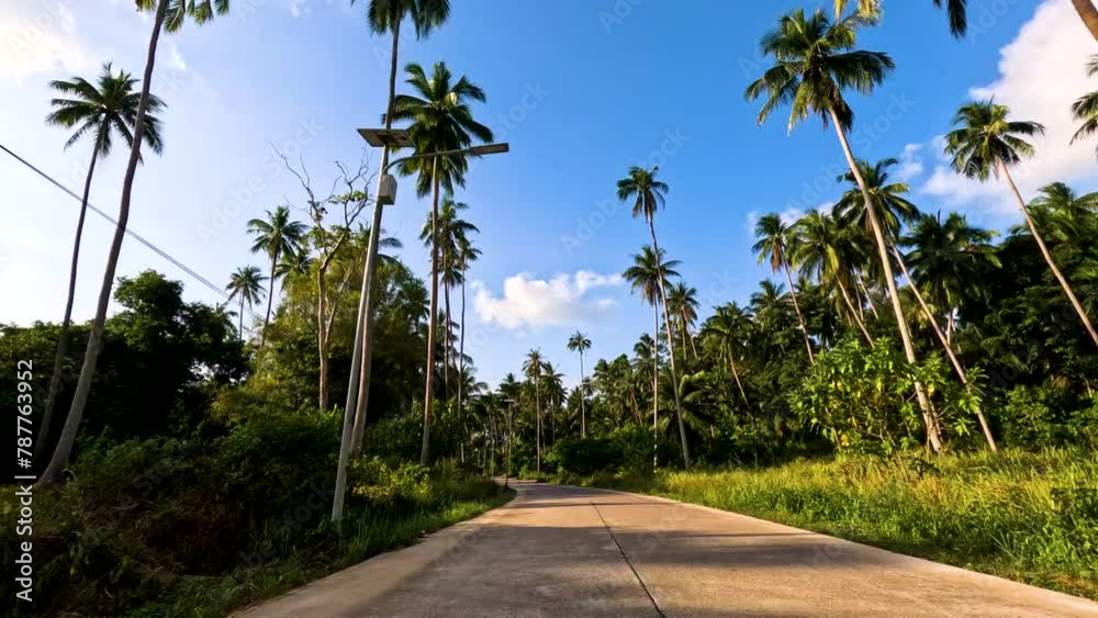 Riding a scooter on a tropical island in Thailand. POV. Tropical island exploring beautiful travel destination having fun ride on scooter. Riding a scooter on a tropical island in Thailand. POV. Tropical island exploring beautiful travel destination having fun ride on scooter.