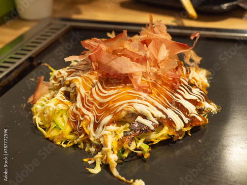 Okonomiyaki on an iron pan in Japan