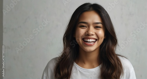 young filipino woman on plain bright white background laughing hysterically looking at camera background banner template ad marketing concept from Generative AI