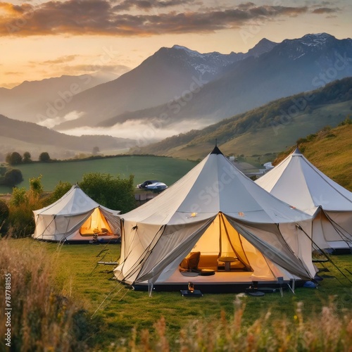 tent in the mountains in summer countryside scene  glamping tents set against a backdrop of rolling hills and majestic mountains  providing a luxurious camping experience amidst pristine natural surro