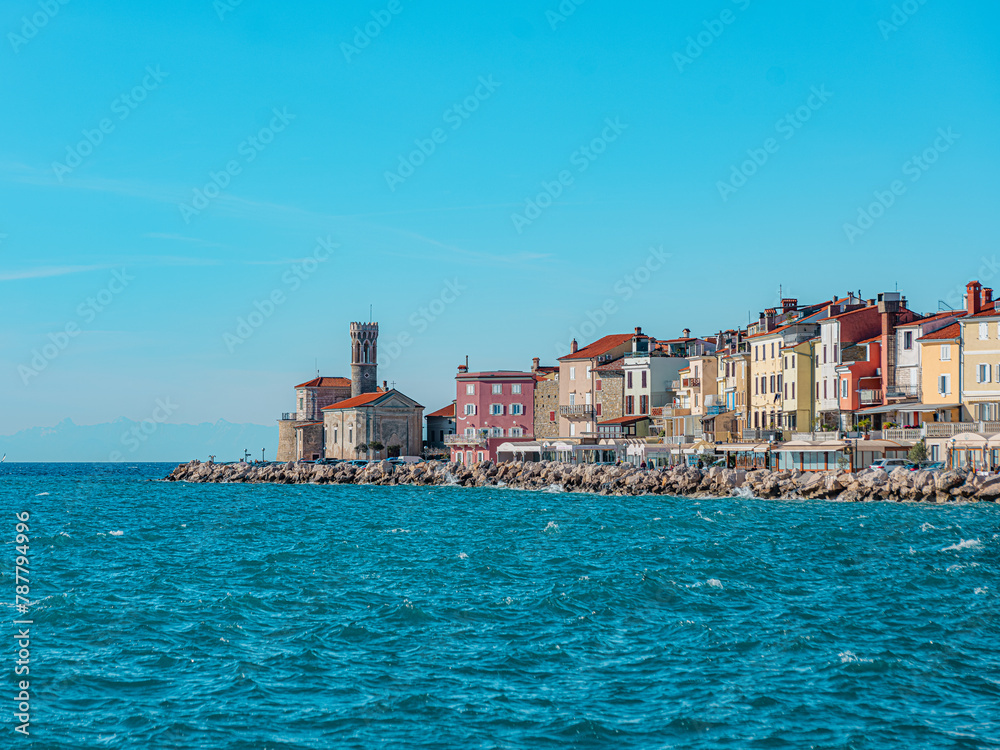 Summer cityscape in Piran, a coastal ancient town in Slovenia. Summer cityscape in Piran, a coastal ancient town in Slovenia.