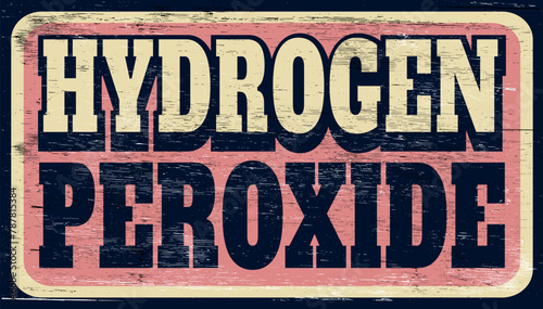 Aged and worn hydrogen peroxide sign on wood