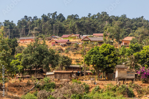 Village above waters of Nam Ou 3 reservoir, Laos