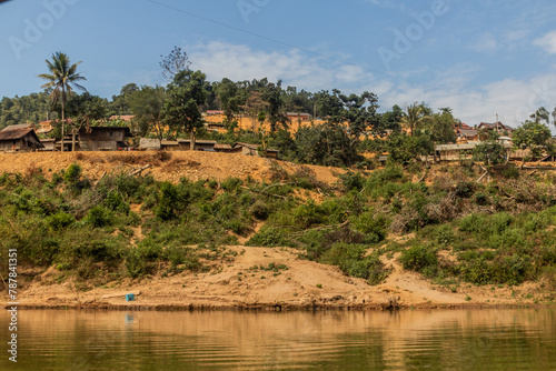 Village above waters of Nam Ou 3 reservoir, Laos © Matyas Rehak