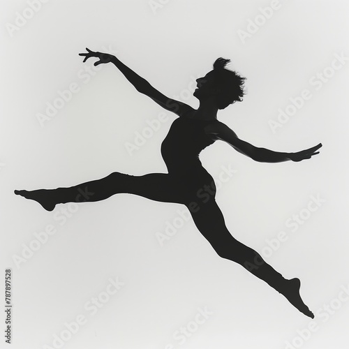 Elegant silhouette of a female ballet dancer performing a jump with extended limbs against a white background.