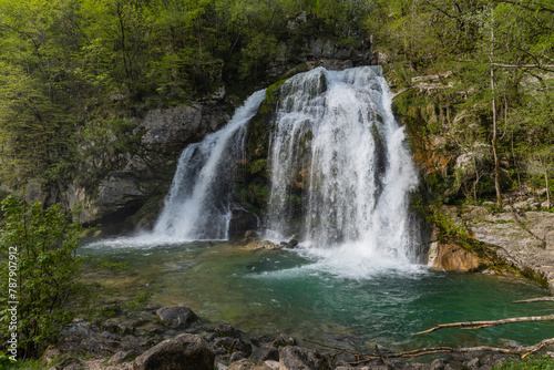 Bovec  Slovenia. Visje waterfalls. Nature trail crystal clear  turquoise water. easy trekking  nature experience  wood path. Waterfalls inside a forest  long photographic exposure  power of nature.