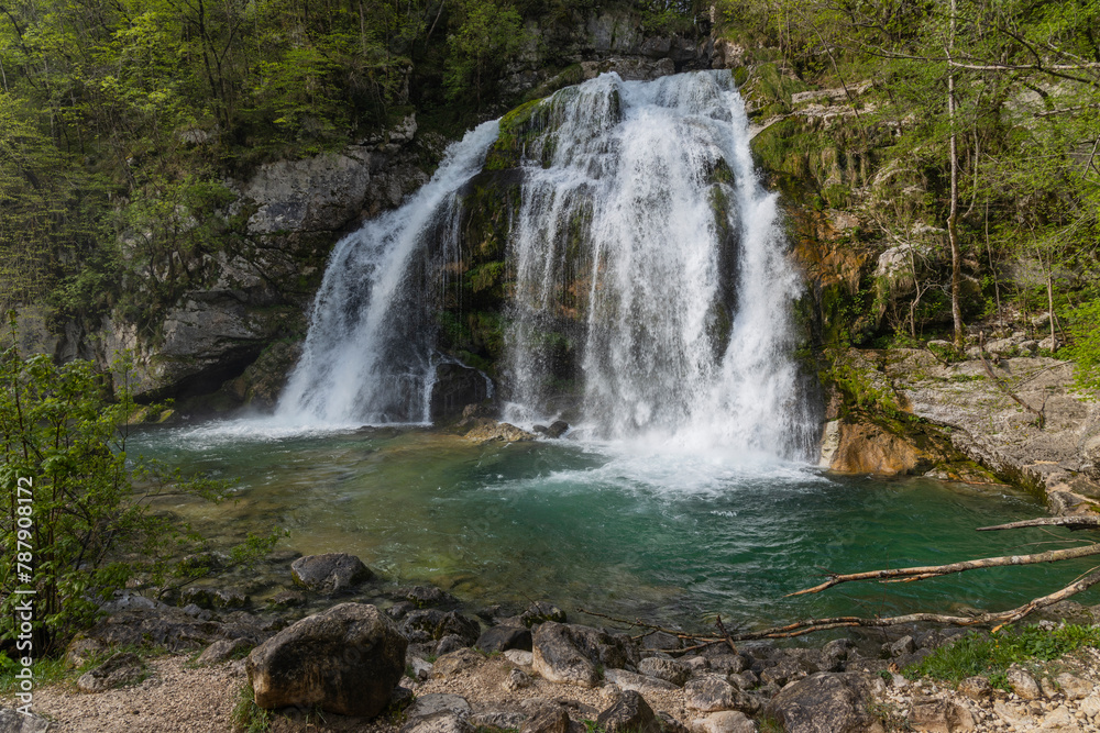 Obraz premium Bovec, Slovenia. Visje waterfalls. Nature trail crystal clear, turquoise water. easy trekking, nature experience, wood path. Waterfalls inside a forest, long photographic exposure, power of nature.
