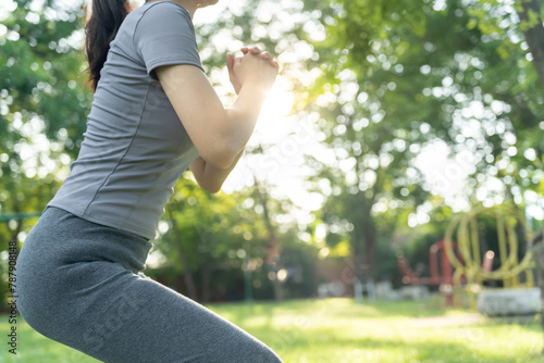 health care female exert on the park. Asian woman doing exercises in morning. balance, recreation, relaxation, calm, good health, happy, relax, healthy lifestyle, reduce stress, peaceful, Attitude photo