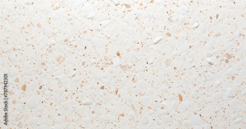 White terrazzo background texture with small beige speckles