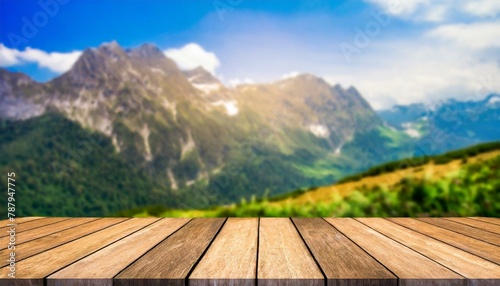 Peak Presentation: Mountain Blur Background Enhances Product Display on Wood Table