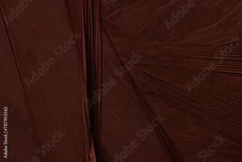 Marsala red abstract plastic foil background