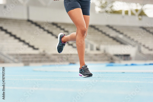 Runner, track and woman athlete on legs, fitness and outdoor exercise for sports competition. Race, stadium position and field cardio event for female person, workout and sprint for fast training
