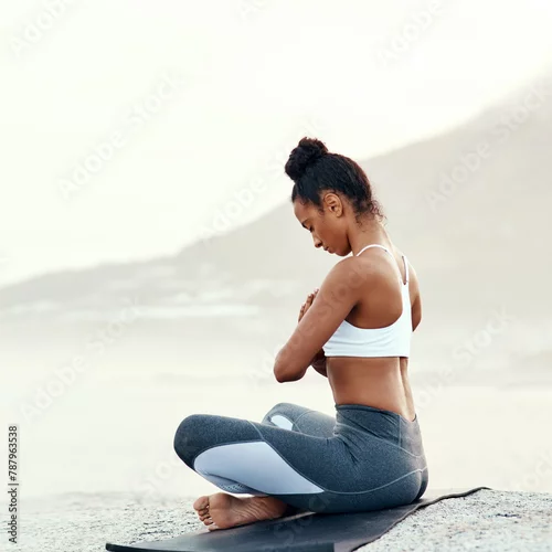 Obraz Fitness, meditation and yoga with woman on beach for mental health, peace or wellness in morning. Exercise, training and zen with sporty person on mat at coast by ocean or sea for balance and mindset
