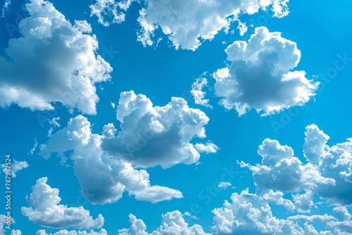 The serene blue sky, expansive clouds, and peaceful sunny day create a tranquil atmosphere