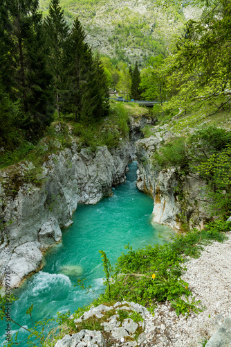 So  a  Bovec  Slovenia. Valley with rapid rivers surrounded by woods. Tibetan wooden bridges. Area for sporting activities such as rafting. Walking and trekking. Amazing turquoise and emerald water.