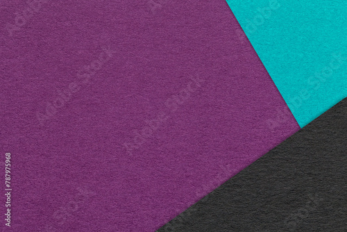 Texture of craft dark violet paper background with turquoise and black border. Vintage abstract purple cardboard. © nikol85