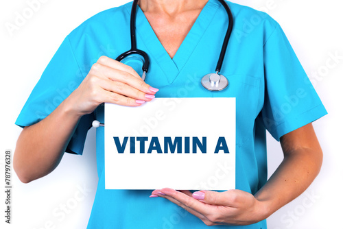 Female doctor holding a tablet with the text Vitamin A. Medical concept.