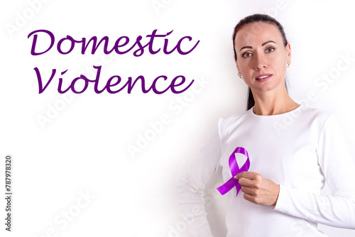 Woman with purple ribbon on a white background, closeup. Symbol of Domestic Violence Awareness photo