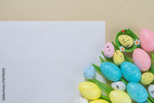 Creative easter flatlay with white paper blank