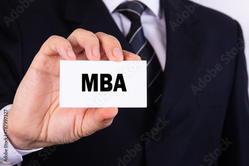 Businessman holding a card with text MBA