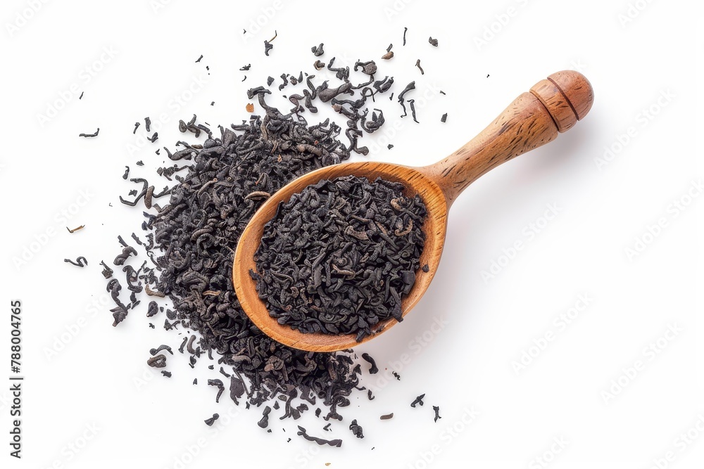 Black tea in wooden spoon on white background View from above Black tea in wooden spoon on white background View from above