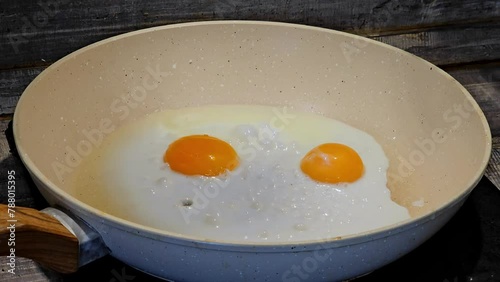 The process of frying scrambled eggs in a pan, time lapse video