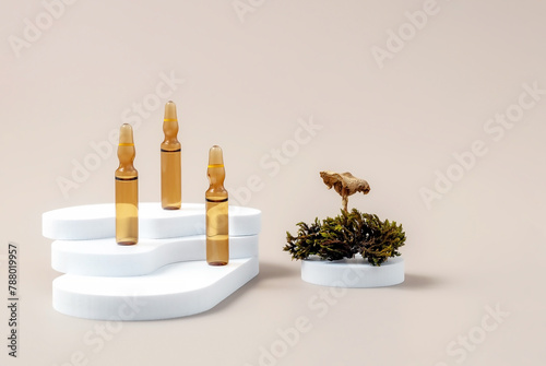 medical ampoules, moss, mushrooms and geometric shapes on a beige background