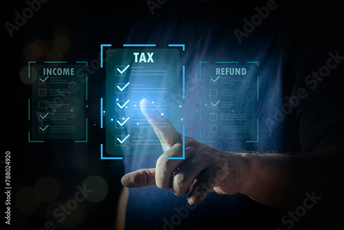 E-tax, Man pointing to tax icon for Individual income tax return form online for tax payment concept. pay online income tax. futuristic virtual screen interface technology.