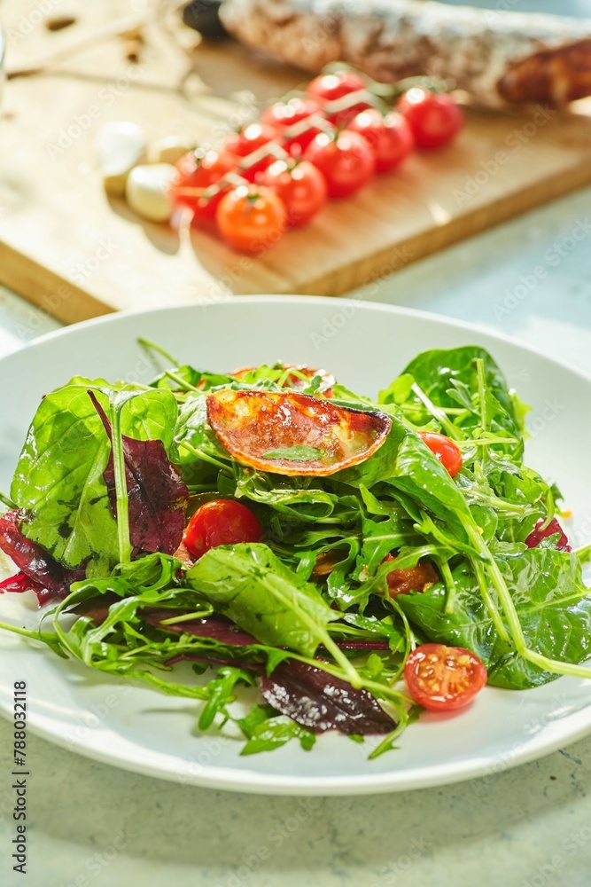 Salad of greens and fried garlic, cherry tomatoes and Chorizo sausage. The cooking process, step-by-step recipe Salad of greens and fried garlic, cherry tomatoes and Chorizo sausage. The cooking process, step-by-step recipe
