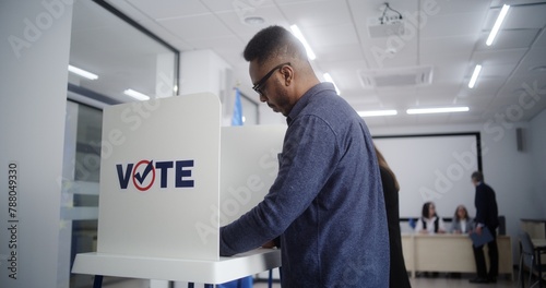 Photos High angle of multiethnic European people voting at polling station during EU elections