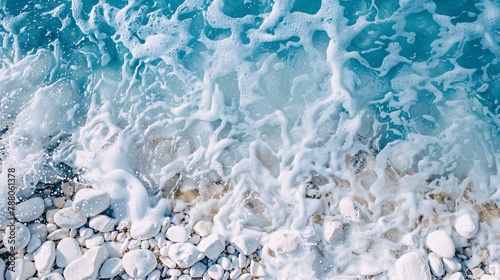 White pebbles on the background of blue water in the pool photo