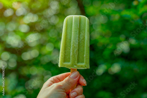 Green mint popsicle in summer light. Generative AI