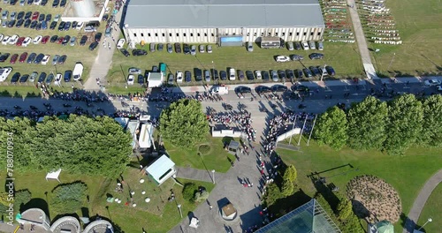 Srebrenica, Bosnia and Herzegovina - 11 July 2022: Aerial View of the Bikers Driving in front of the Srebrenica Genocide Memorial Cemetery. People honoring the victims on the Remembrance Day photo