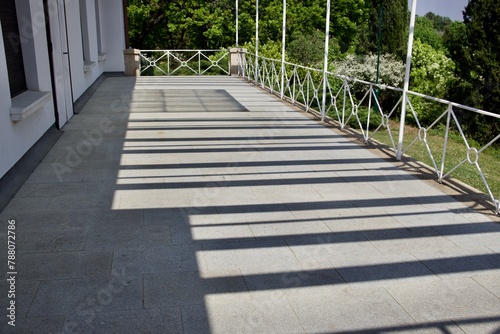 Fototapeta Naklejka Na Ścianę i Meble -  shadow on the veranda early in the morning