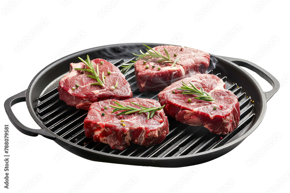 Flying raw beef steaks, with herbs, oil and spices with grill pan and kitchen
isolated on white background