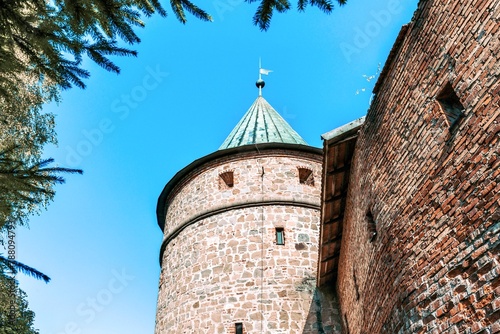 View of the Forge Tower, which is surrounded by high fortress walls. The tower was erected in the fourteenth century. Bech, Poland.