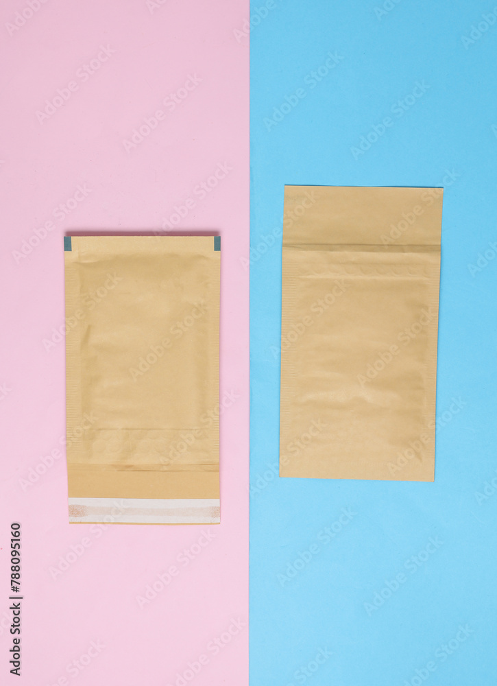 Fototapeta premium Shipping Post Parcel Envelopes on Pink Blue Background