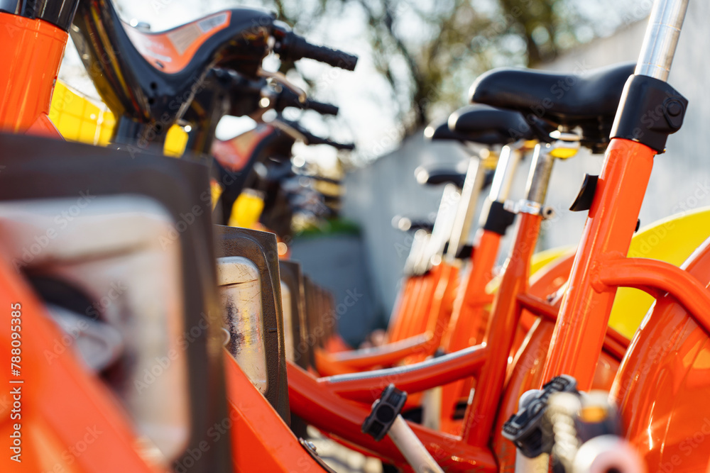 A public bicycle rental point for leisure activity and moving around the city. Eco-friendly transport and sustainable lifestyle A public bicycle rental point for leisure activity and moving around the city. Eco-friendly transport and sustainable lifestyle